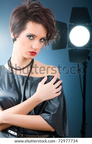 Young attractive girl with in the studio shooting