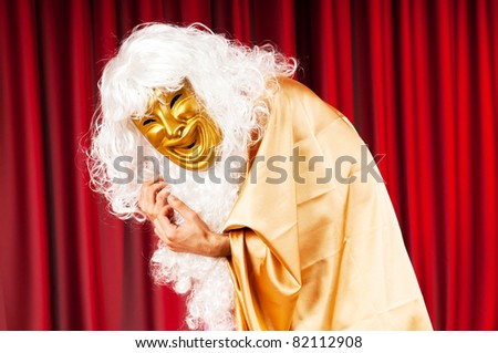Actor with mask in a funny theater concept