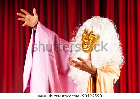 Actor with mask in a funny theater concept