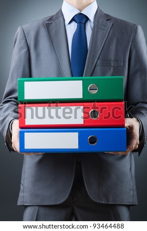 Young businessman with folders
