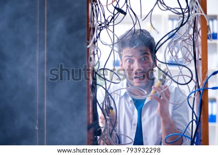 Computer repairman working on repairing network in IT workshop