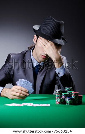 Casino player playing with chips