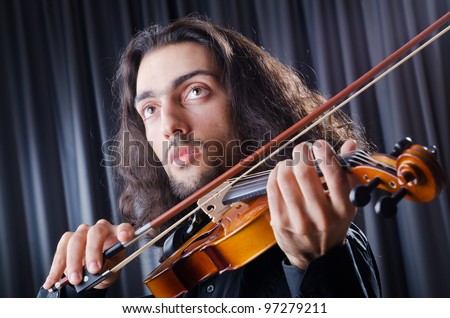 Young violin player playing