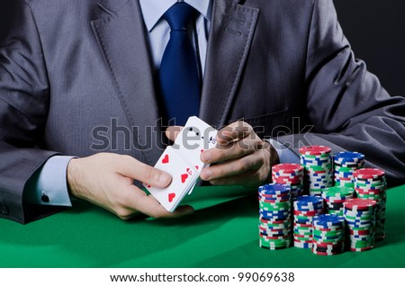 Casino player playing with chips