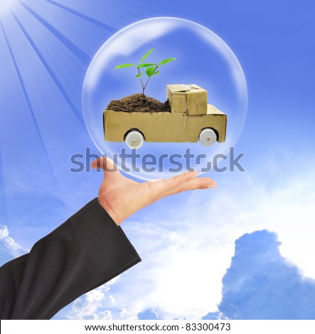 Hand and the car in a bubble.