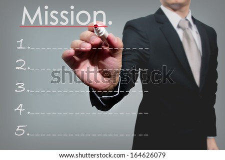 business man hand checking mission.