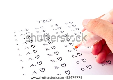 Hand on pen choosing the test list on the examination