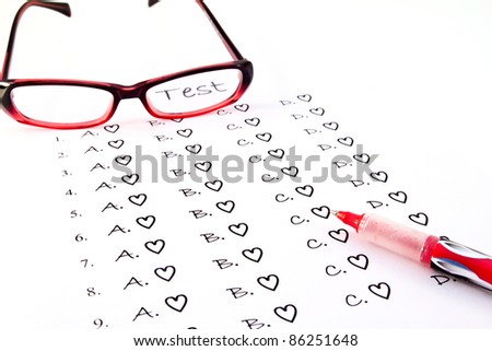 The test list and red pen and glasses  on the examination