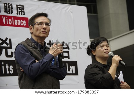 HONG KONG - March 2: Joseph Tse Chi Fung on stage in the march to condemn the brutal knife attack on Kevin Lau Chun-To, ex-editor of Ming Pao, and support press freedoms on March 2, 2014 in Hong Kong.