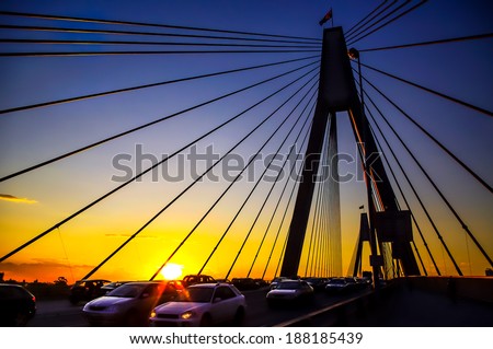 cable-stayed bridge Anzac Bridge in Sydney at sunset with loads of traffics