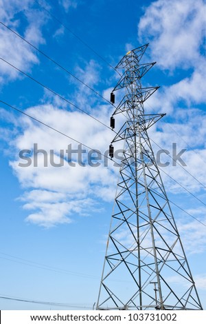 Electricity pylons with long cable at day