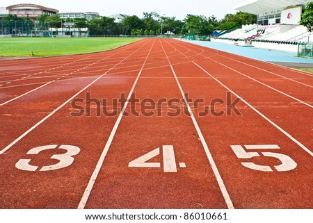 Number three  four and five on the start of a running track