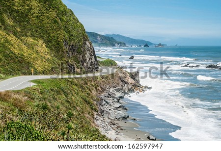 New Zealand Coastal Highway:  A scenic road winds along the western shore of New Zealand\'s South Island.