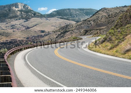 Wyoming Mountain Road:  A curving road climbs through the mountains of Bighorn National Forest in northeast Wyoming.