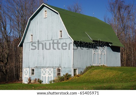 Blue Barn: A large wooden barn wears a subtle shade of blue on an autumn afternoon in Pennsylvania.