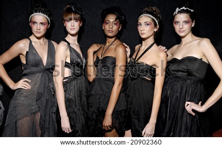 MELBOURNE - SEPTEMBER 25: A group of female models wearing garments by Anna Campbell, backstage at \
