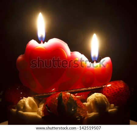 strawberry butter cream cake with heart candle on candlelight feeling