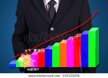businessman holding wine glass present success business statistic graph on blue