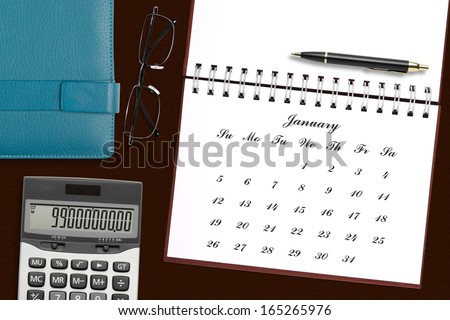 blank calendar in notebook with stationery on the desk for your plan