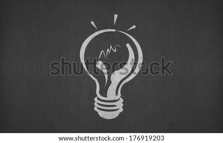 hand drawing light bulb on blackboard for your ideas