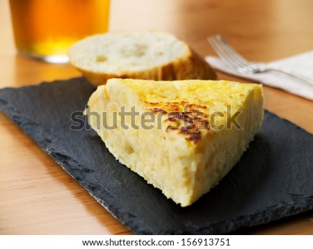 Typical Spanish Pincho De Tortilla De Patatas In Slate Plate
