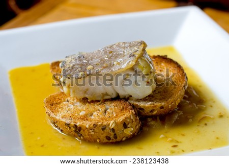 Typical spanish codfish tapa cooked at low temperature.