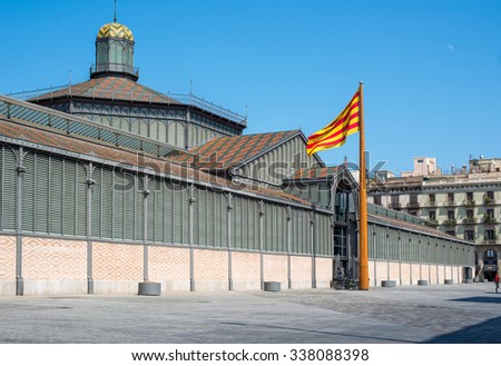 Barcelona, Spain - July 24, 2015: \
The principal facade of El Born market or Mercat del Born, chaired by the flag of Catalunya. Born district. Barcelona, Catalonia, Spain.