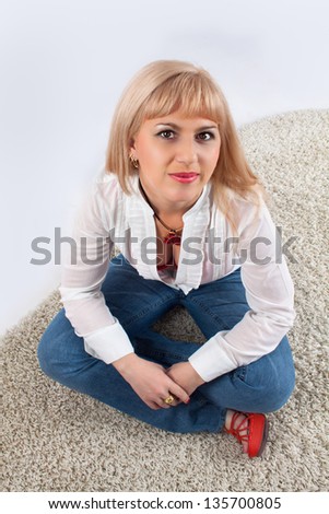 woman in jeans seat on floor