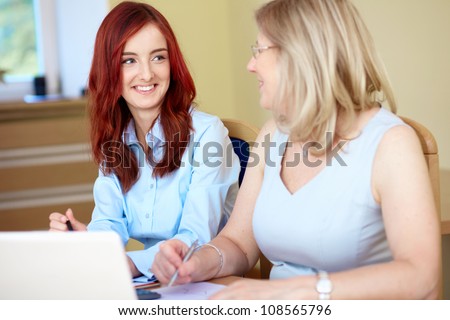 Senior and junior businesswoman, conference room shoot