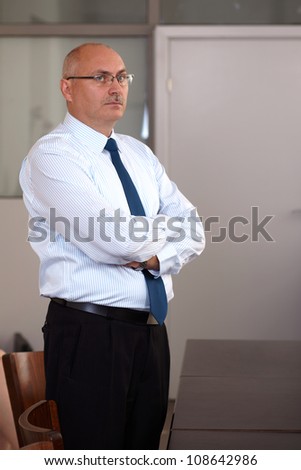 Senior businessman in his office, angry face