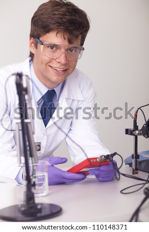 Young laboratory technician doing some tests