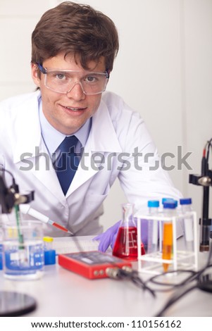 Young laboratory technician doing some tests