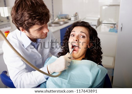 Scared patient at dentist office have teeth checkup