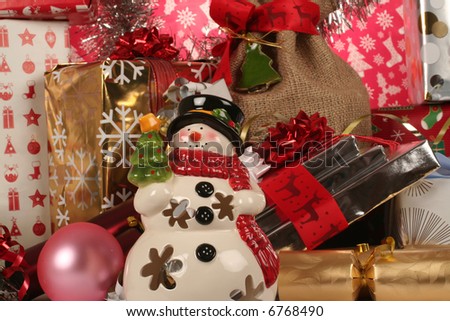 snowman with gifts around him