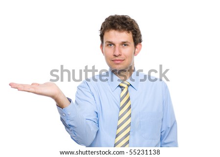 young adult male model in blue shirt and yellow necktie, holds his right hand flat, display or show something, studio shoot isolated on white