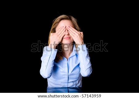 young very attractive female covers her eyes with her hands, fear or surprise concept, studio shoot isolated on white