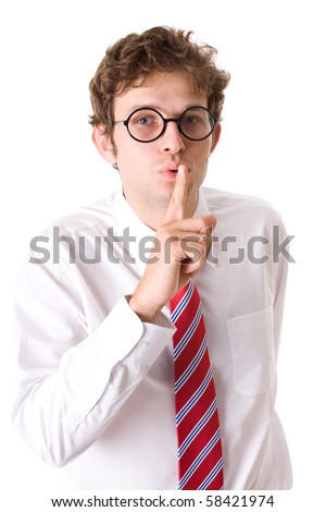 stock photo young attractive businessman shows'silence please' gesture