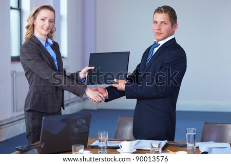 handshake after contract signing, business office shoot