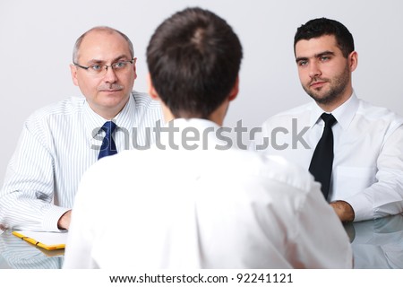 Senior and young colleague interview candidate for a job