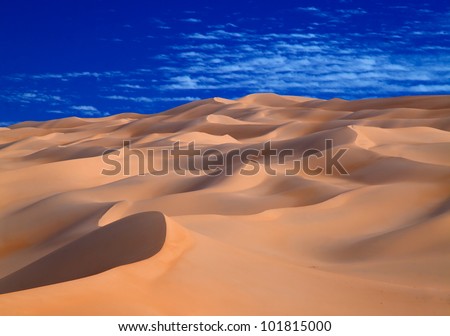 Sky and sand meet in sahara desert