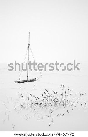 Lonely Sailing Boat in Winter
