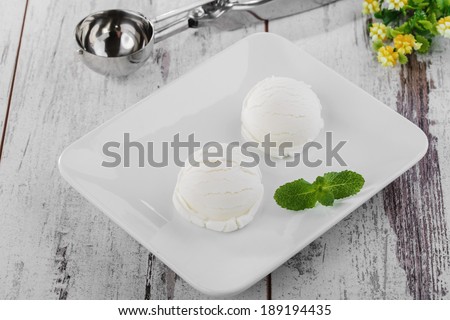 white ice cream ball on a plate