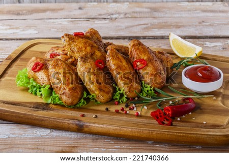 fried chicken wings with red sauce