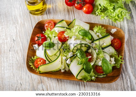 Zucchini salad with tomatoes and cheese