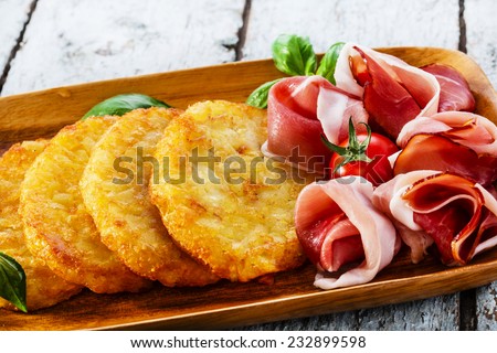 potato pancakes with pancetta and tomato