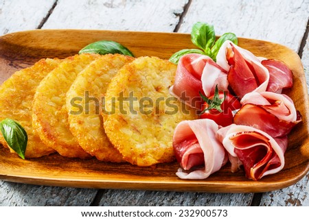 potato pancakes with pancetta and tomato