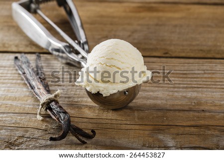 ball of vanilla ice cream in a spoon scoop