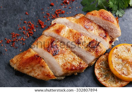 roast chicken breast with lemon and vegetables
