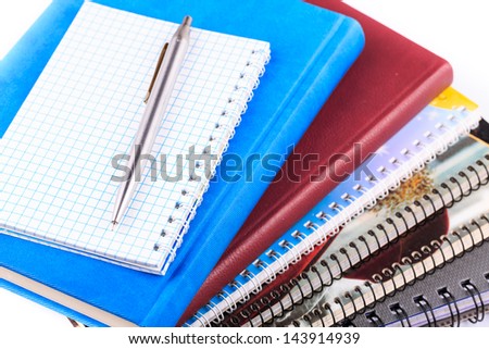 Note book for taking notes with a pen isolated on white