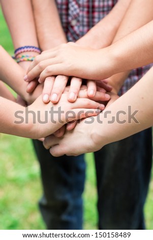 Teens' Hands Together. Support, Teamwork, Togetherness Concept